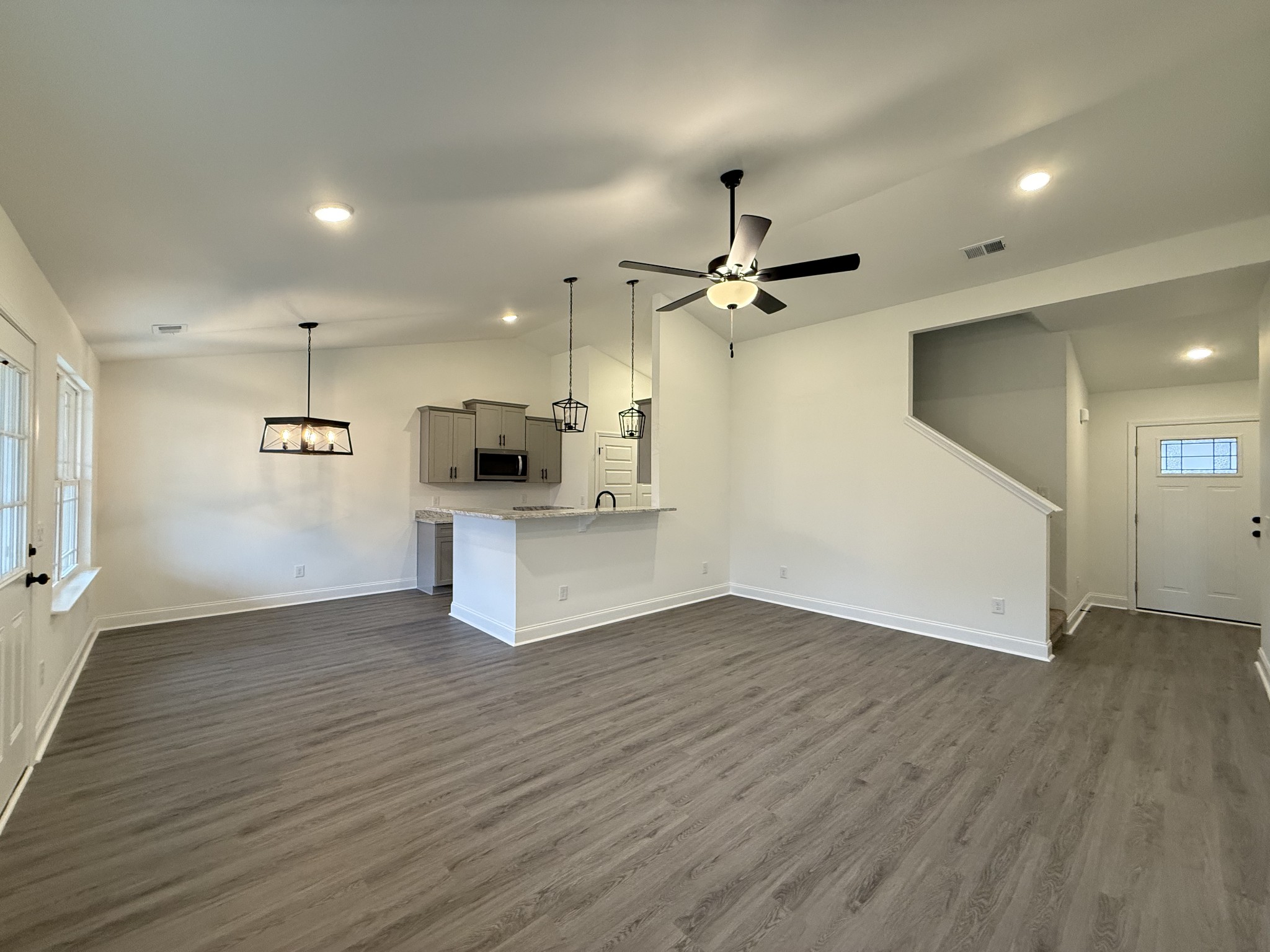 1135 Javier Drive Springfield, TN 37172 - Photo 2 of 11 a view of a kitchen with a sink a ceiling fan and wooden floor