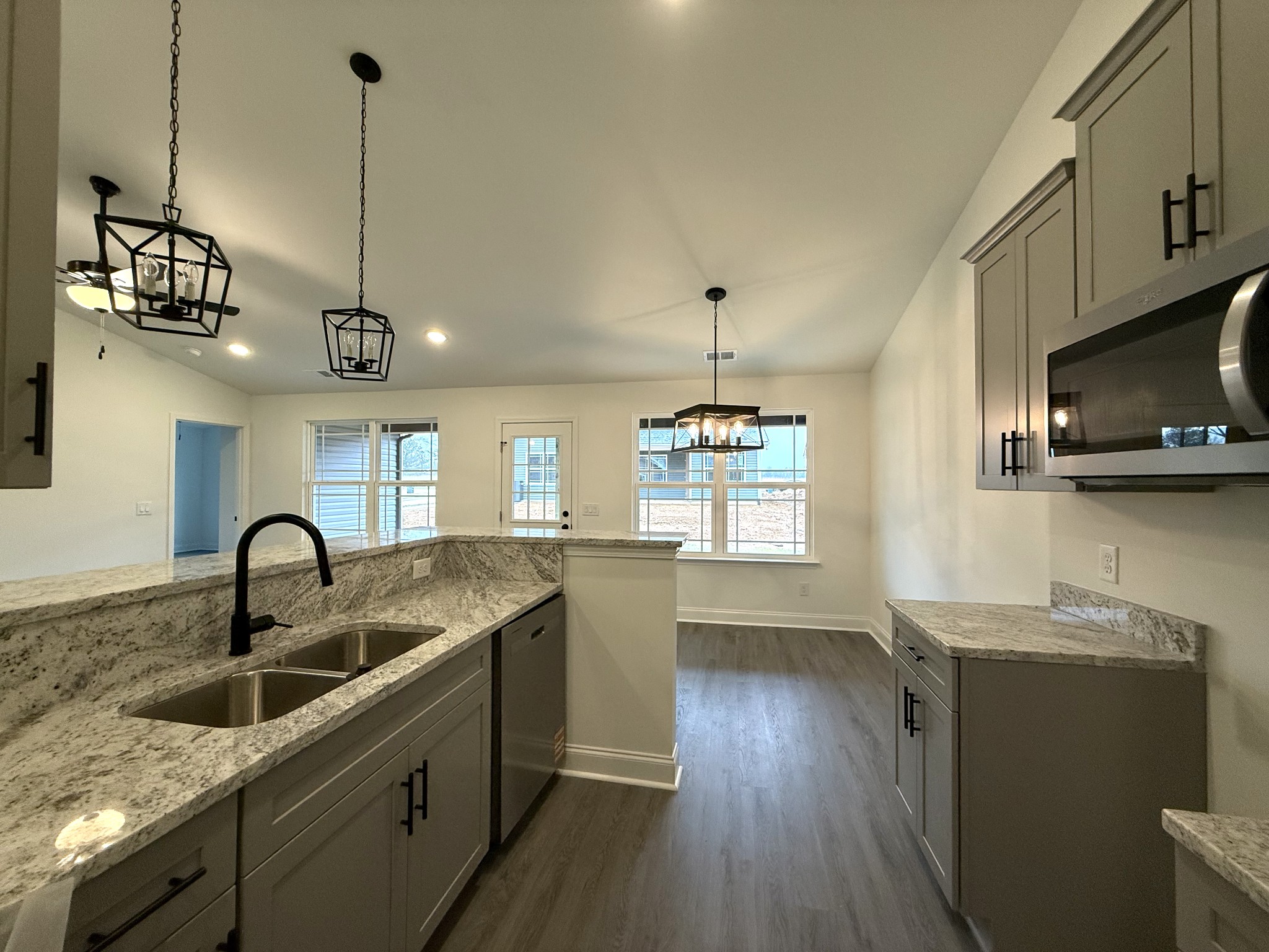 1135 Javier Drive Springfield, TN 37172 - Photo 3 of 11 a kitchen with granite countertop a sink a counter space appliances and cabinets