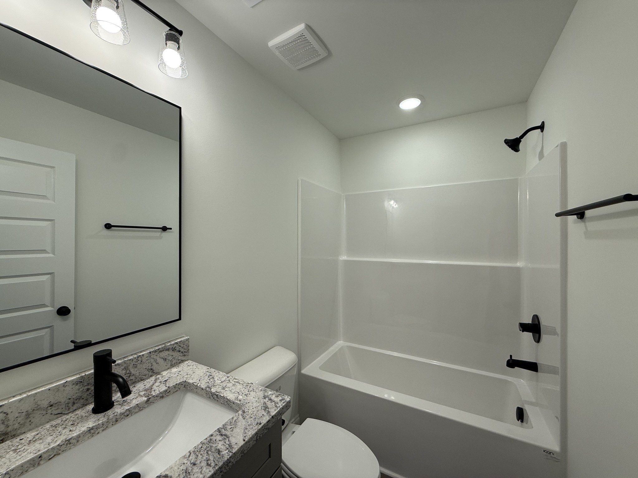 1135 Javier Drive Springfield, TN 37172 - Photo 9 of 11 a bathroom with a granite countertop sink toilet and shower