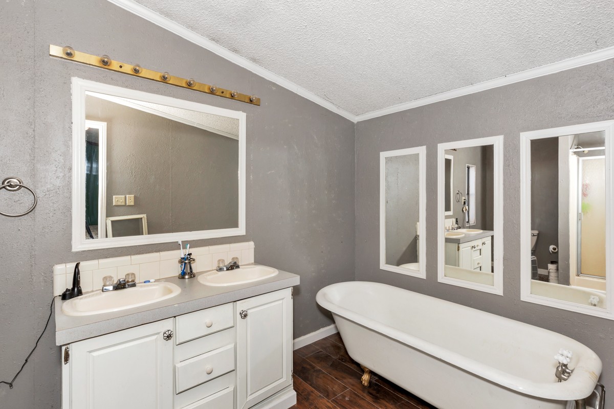 1919 Pleasant Hill Road Prospect, TN 38477 - Photo 15 of 24 a bathroom with a sink a toilet a mirror and vanity