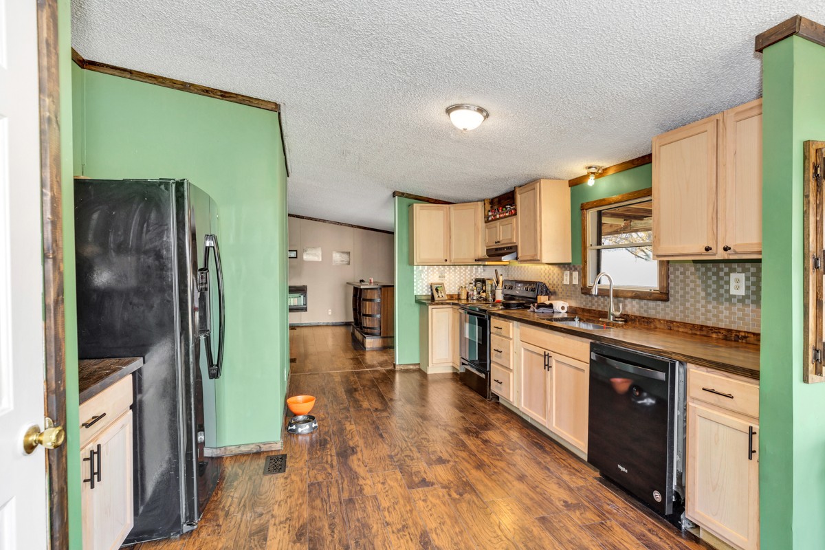 1919 Pleasant Hill Road Prospect, TN 38477 - Photo 8 of 24 a large kitchen with stainless steel appliances granite countertop a refrigerator a stove top oven a sink and dishwasher