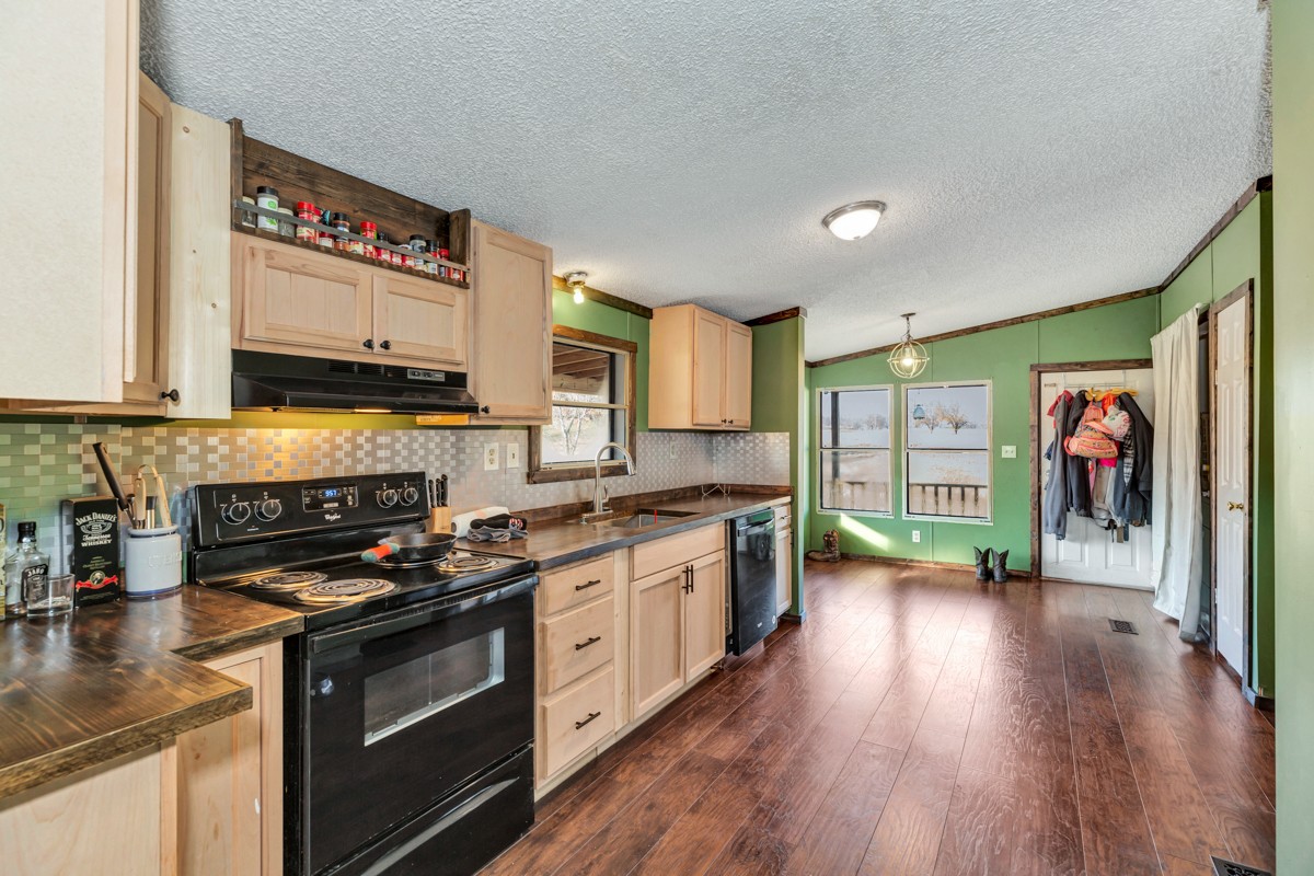 1919 Pleasant Hill Road Prospect, TN 38477 - Photo 10 of 24 a kitchen with stainless steel appliances a stove a sink and a refrigerator