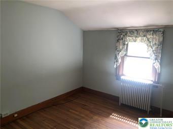 4024 South 2nd Street Emmaus, PA 18049 - Photo 14 of 19 an empty room with wooden floor and windows