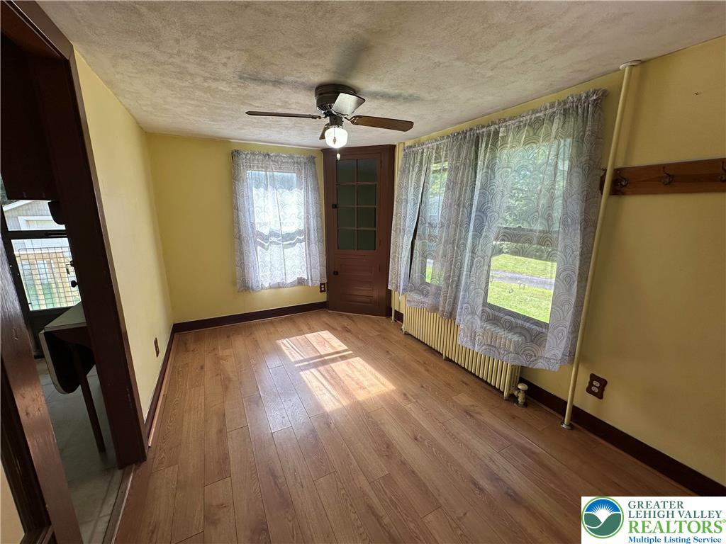 4024 South 2nd Street Emmaus, PA 18049 - Photo 9 of 19 a view of empty room with wooden floor and fan