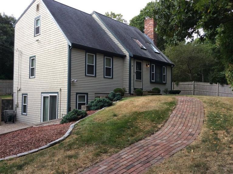 39 Skating Rink Road Hyannis, MA 02601 - Photo 2 of 19 a front view of a house with a yard