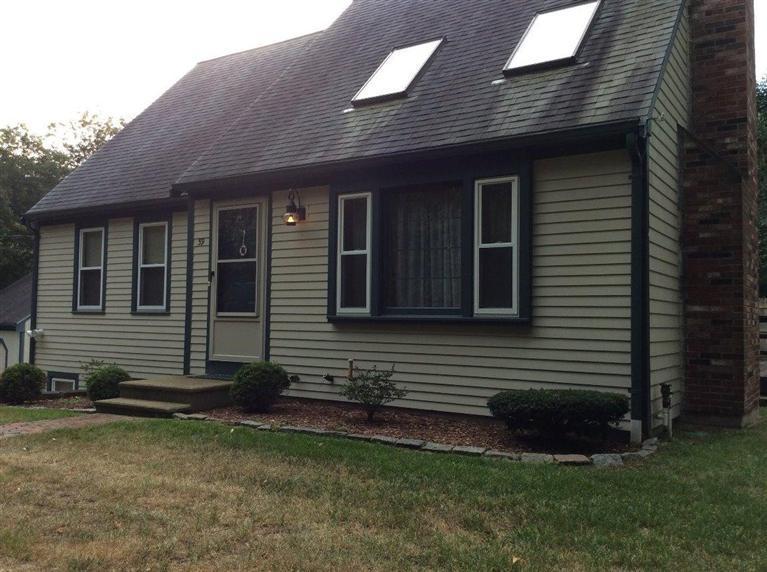 39 Skating Rink Road Hyannis, MA 02601 - Photo 3 of 19 a front view of a house with a garden