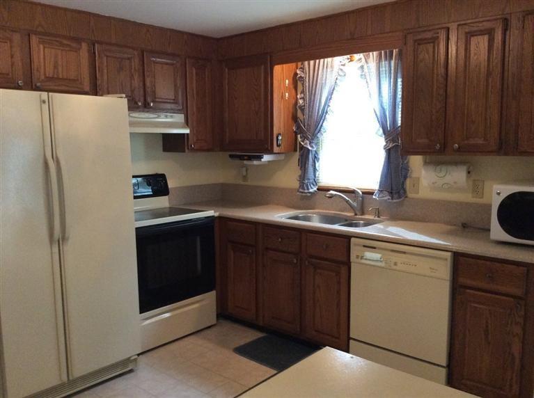 39 Skating Rink Road Hyannis, MA 02601 - Photo 4 of 19 a kitchen with a refrigerator sink and cabinets