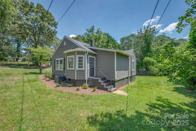 a view of backyard with a garden and plants