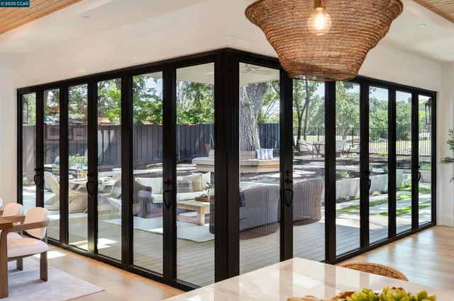 a bedroom with a bed and glass window