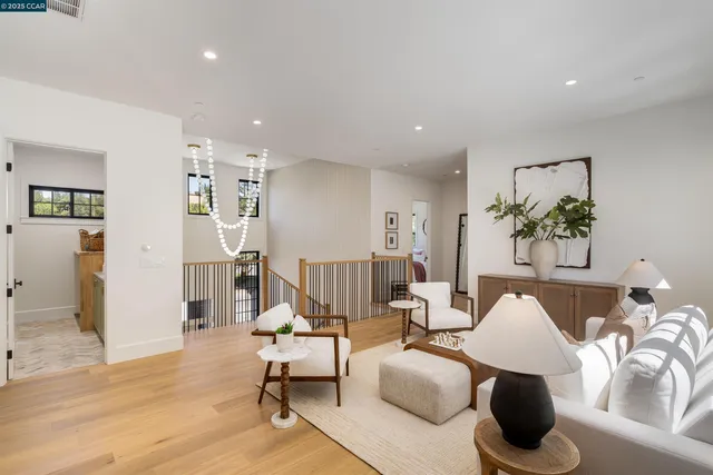 a bedroom with a large bed and wooden floor