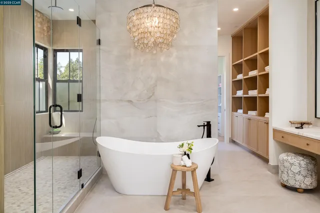 a bathroom with a granite countertop sink a toilet and shower