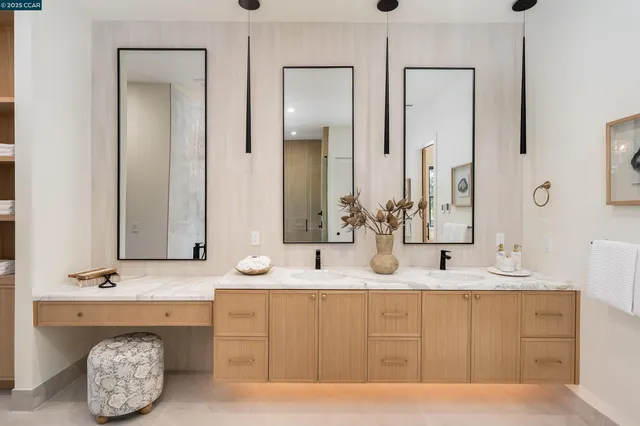 a living room with patio furniture and a garden