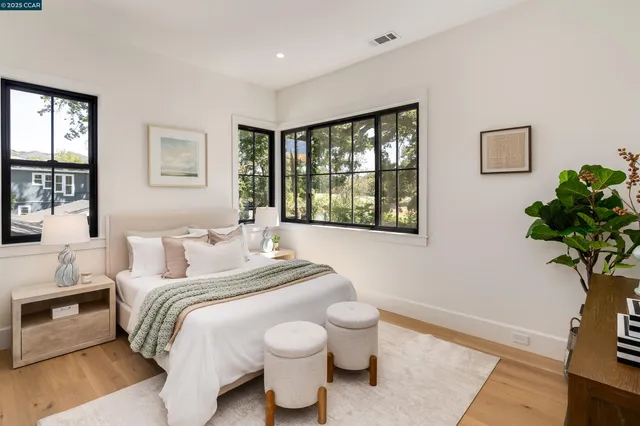 a living room with patio furniture and a fireplace