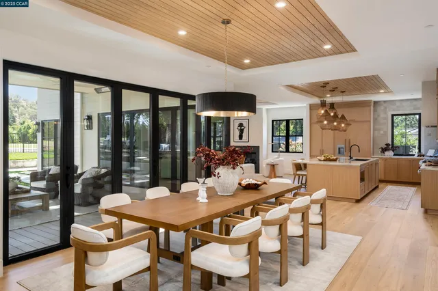 a kitchen with a table and chairs in it