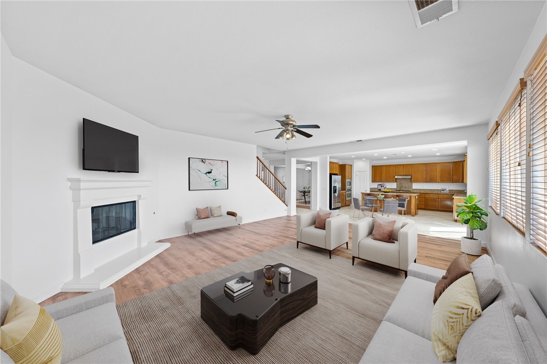 a living room with furniture fireplace and a flat screen tv