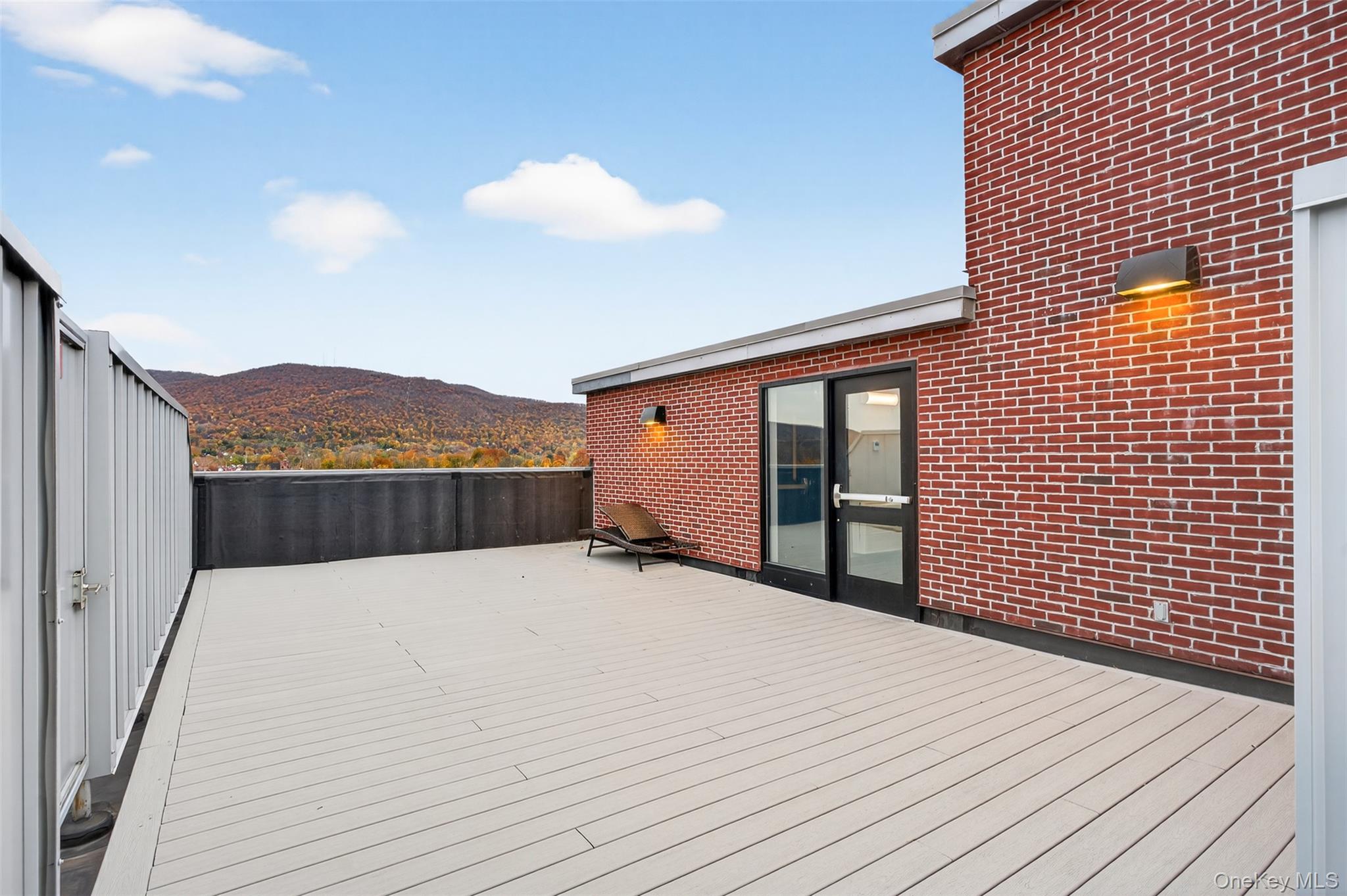 249 Main Street, Unit 305 Beacon, NY 12508 - Photo 21 of 36 Wooden terrace with a mountain view