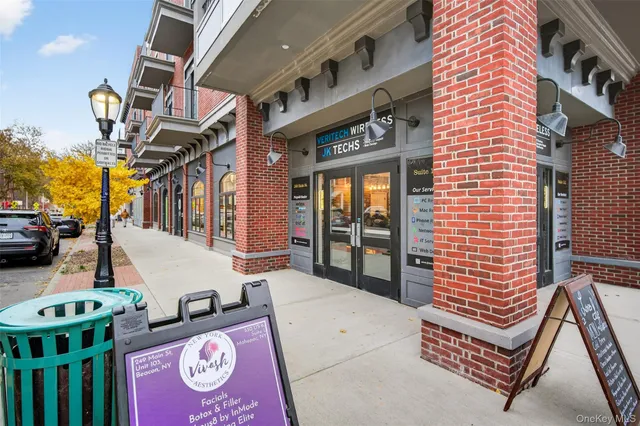 a balcony with table and chairs