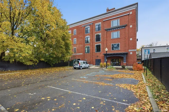 a red brick building with trees in front of it