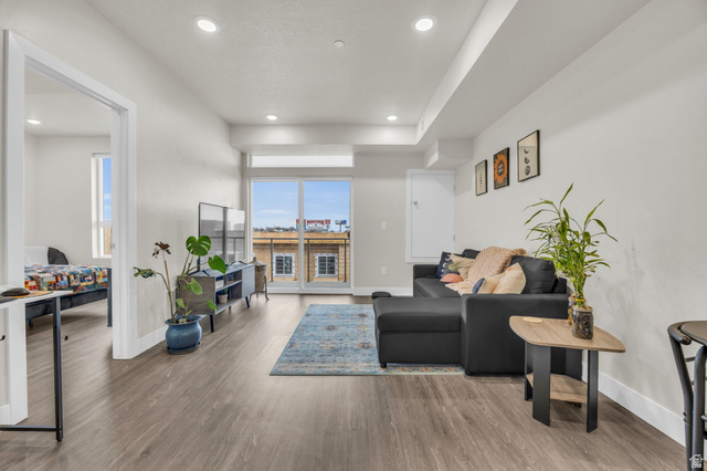 2101 North Main Street, Unit 409 Sunset, UT 84015 - Photo 6 of 18 Living area with light wood-style flooring and recessed lighting