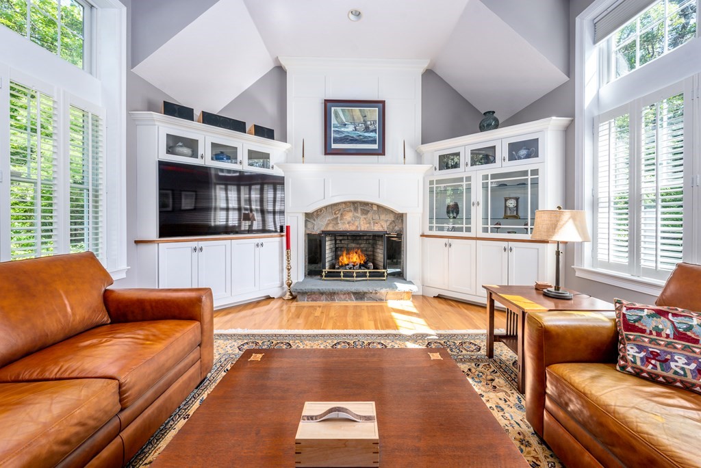 24 Miller Farm Road Mashpee, MA 02649 - Photo 12 of 28 a living room with furniture fireplace and flat screen tv