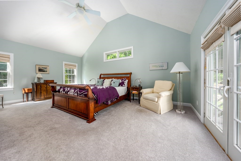 24 Miller Farm Road Mashpee, MA 02649 - Photo 16 of 28 a spacious bedroom with a bed and a couch