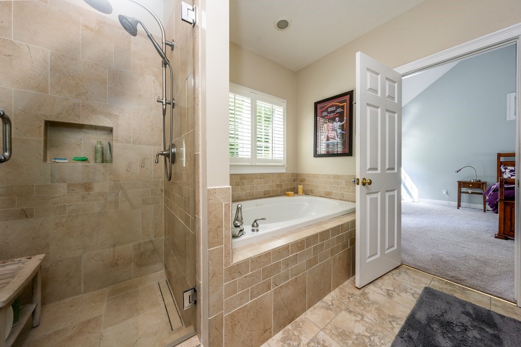 24 Miller Farm Road Mashpee, MA 02649 - Photo 17 of 28 a bathroom with a tub a sink and a shower