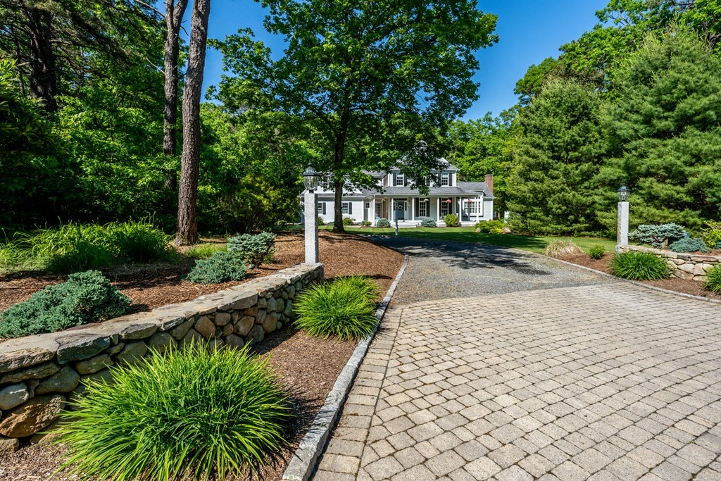 24 Miller Farm Road Mashpee, MA 02649 - Photo 3 of 28 a view of a pathway both side of house