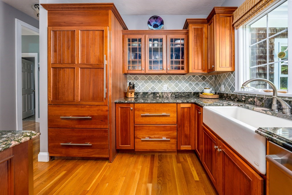24 Miller Farm Road Mashpee, MA 02649 - Photo 9 of 28 a kitchen with stainless steel appliances granite countertop a refrigerator and a stove