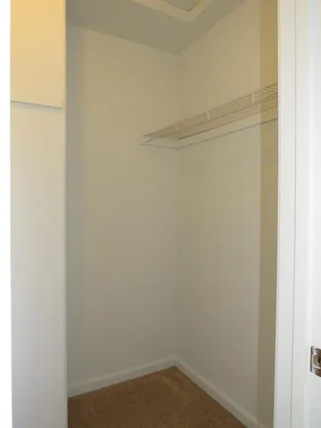 a bathroom with a granite countertop sink a large mirror and a bathtub
