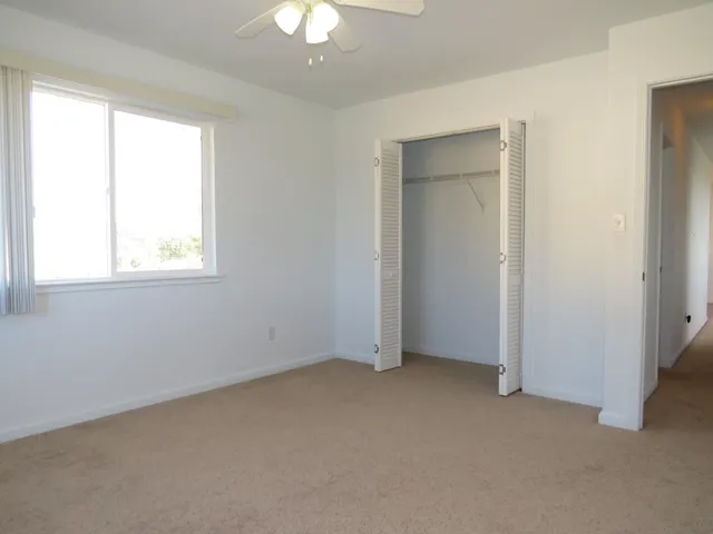 a view of balcony with wooden floor