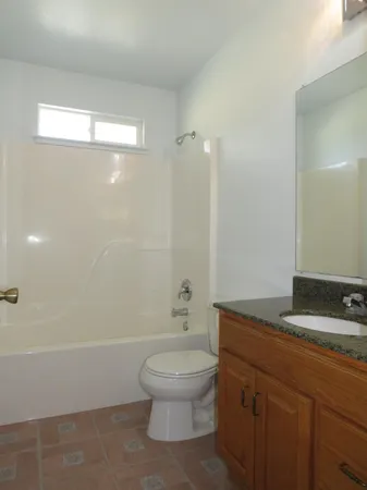 a kitchen with a sink a stove and a refrigerator