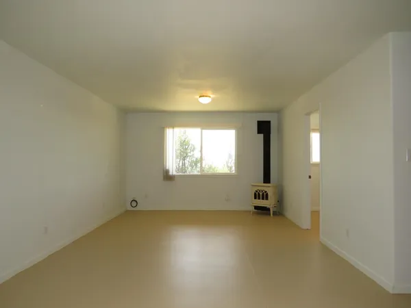 a view of an empty room with a window