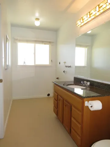 a view of an empty room and a window