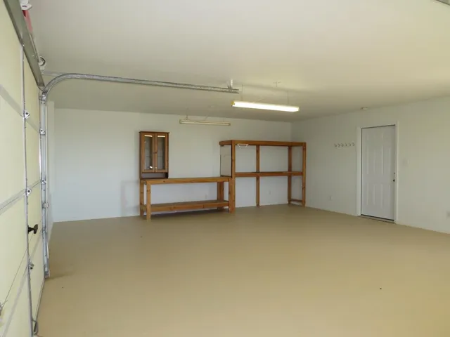 a kitchen with a sink a stove and a refrigerator