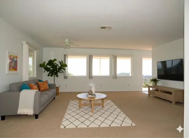 a view of an empty room with a window