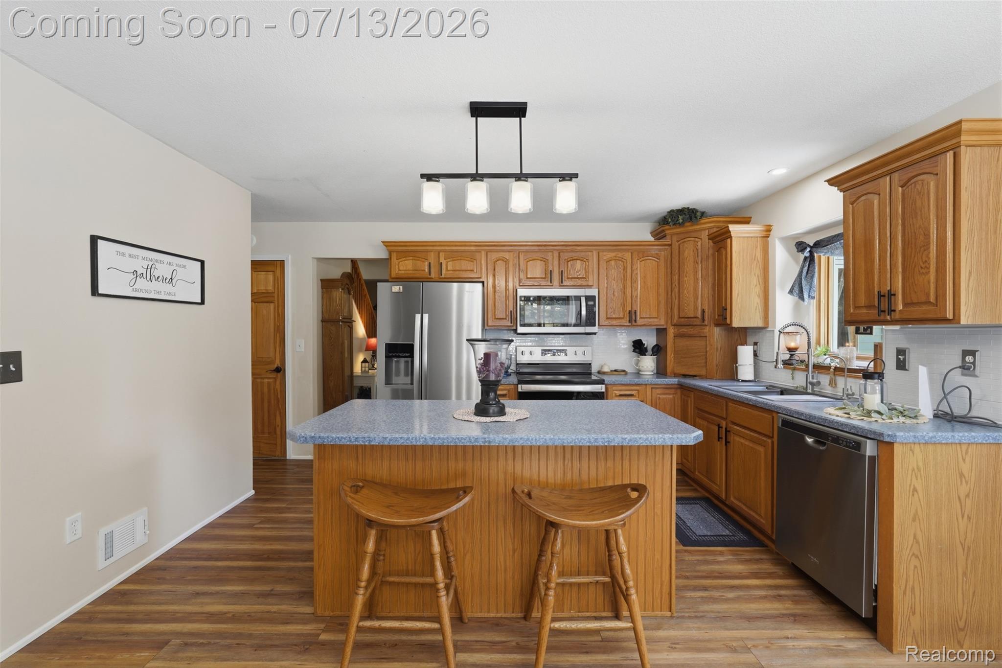 10525 Antcliff Road Brooklyn, MI 49230 - Photo 14 of 80 Kitchen featuring new laminate flooring and panoramic views from the wraparound porch