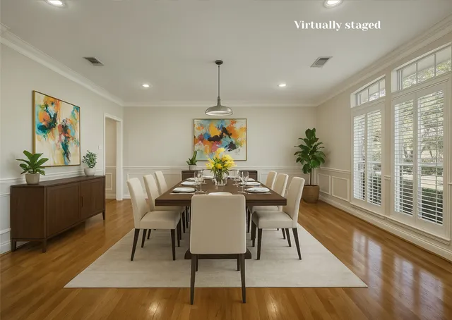 a dining room with furniture a rug and wooden floor