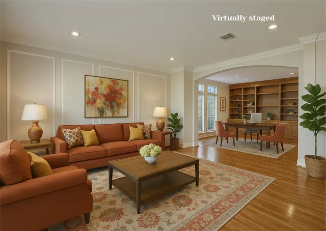 a living room with furniture and wooden floor