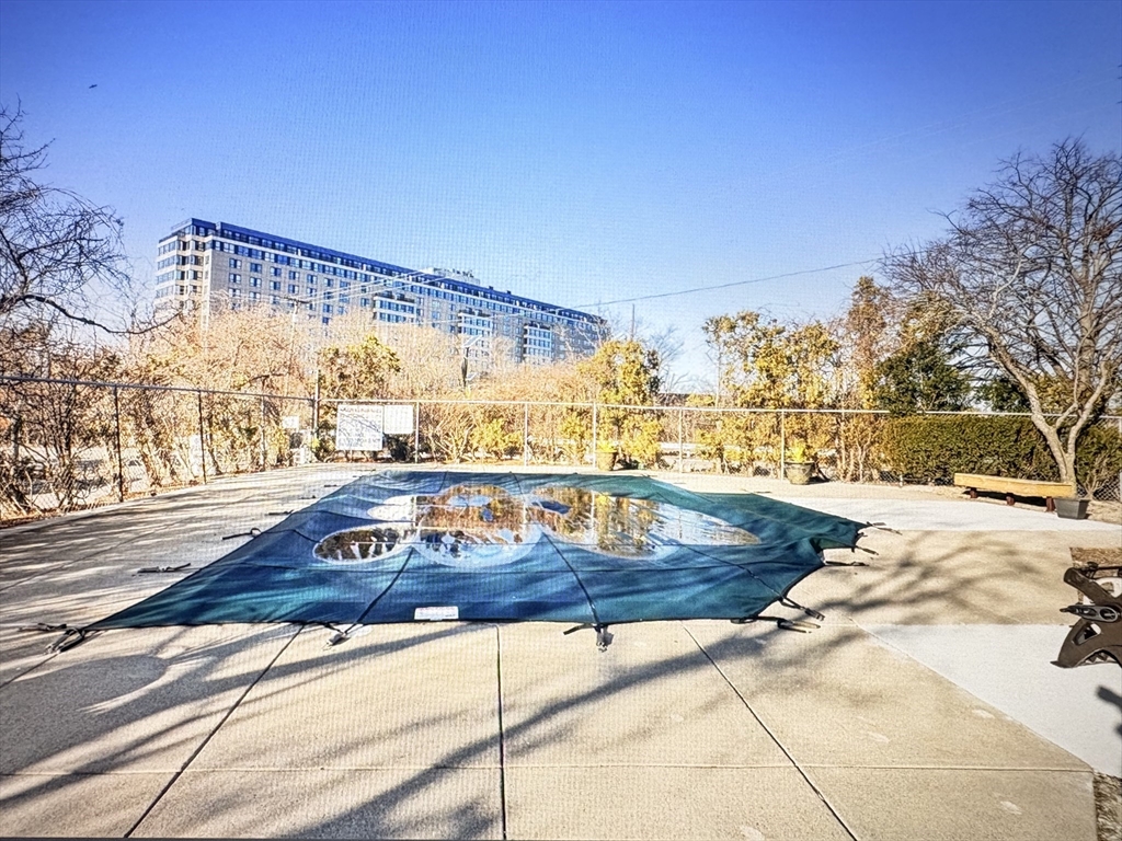133 Commander Shea Boulevard, Unit 709 Quincy, MA 02171 - Photo 16 of 16 a view of a swimming pool with a yard