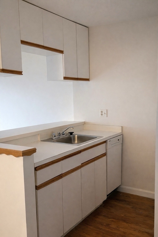 133 Commander Shea Boulevard, Unit 709 Quincy, MA 02171 - Photo 6 of 16 a utility room with sink dryer and washer