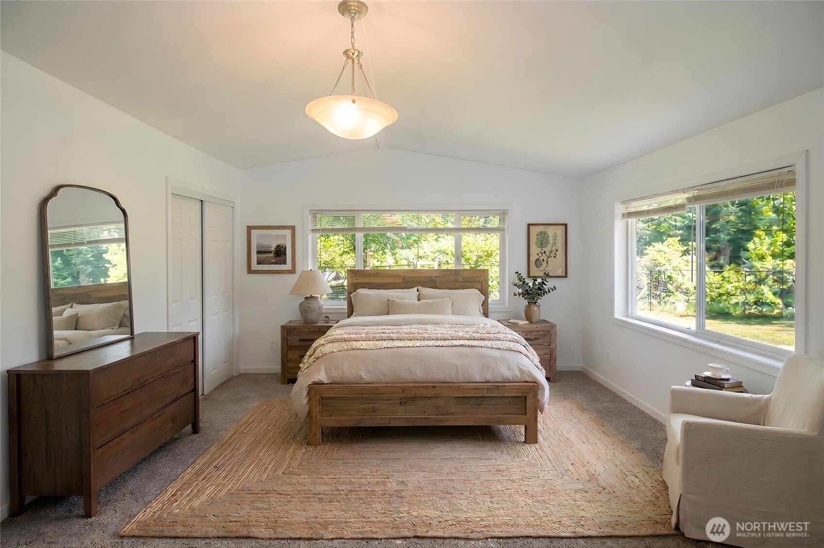 89 Slab Camp Road Sequim, WA 98382 - Photo 18 of 40 a spacious bedroom with a bed and a window