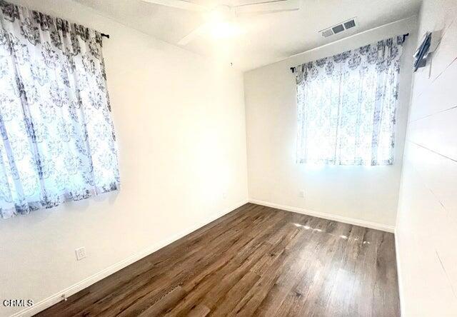 3431 North Oxnard Boulevard, Unit B Oxnard, CA 93036 - Photo 5 of 15 a view of a room with wooden floor and walls