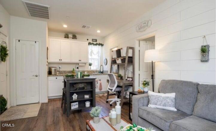 3431 North Oxnard Boulevard, Unit B Oxnard, CA 93036 - Photo 7 of 15 a living room with furniture and wooden floor