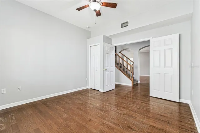a kitchen with granite countertop a refrigerator stove and microwave