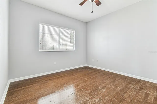 a view of a kitchen with wooden floor and a kitchen