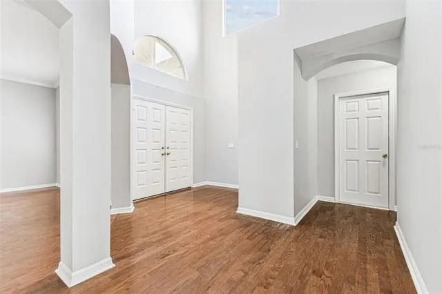 a white bath tub sitting in a bathroom next to a window