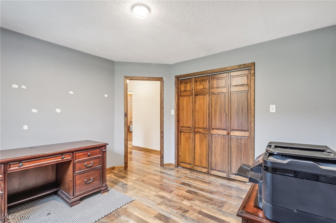 45375 North Ridge Road Amherst, OH 44001 - Photo 24 of 50 Office / Bedroom featuring a textured ceiling and light hardwood / wood-style floors