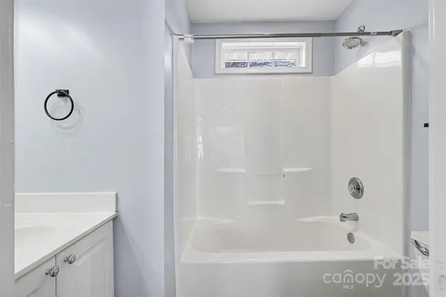 a bathroom with a shower and a bathtub
