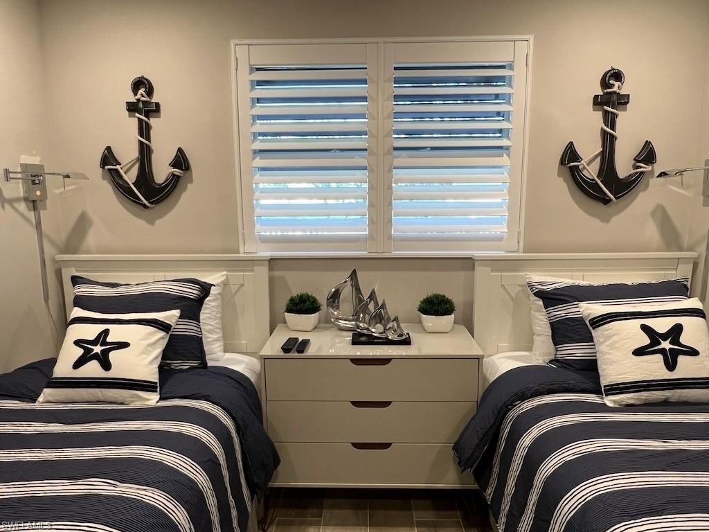 2270 Harbor Road Naples, FL 34104 - Photo 13 of 21 a bedroom with a bed and a dresser