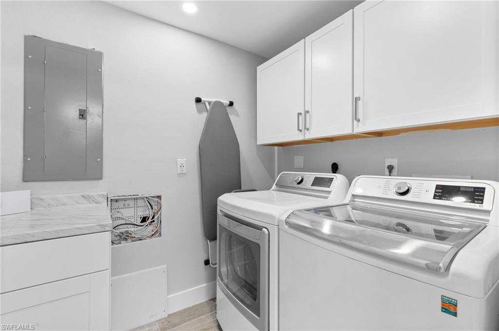 2270 Harbor Road Naples, FL 34104 - Photo 14 of 21 a utility room with dryer and washer